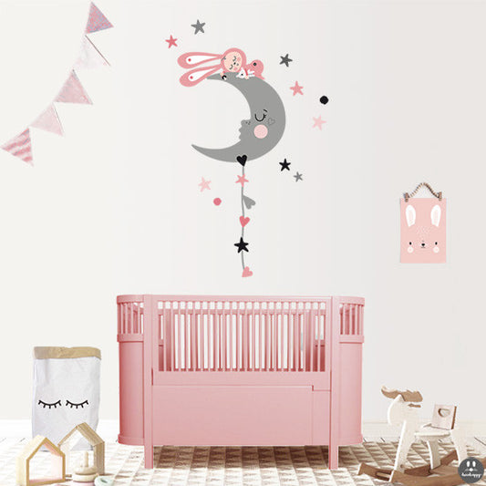 Vinilo infantil dormido en la luna estilo nórdico rosa